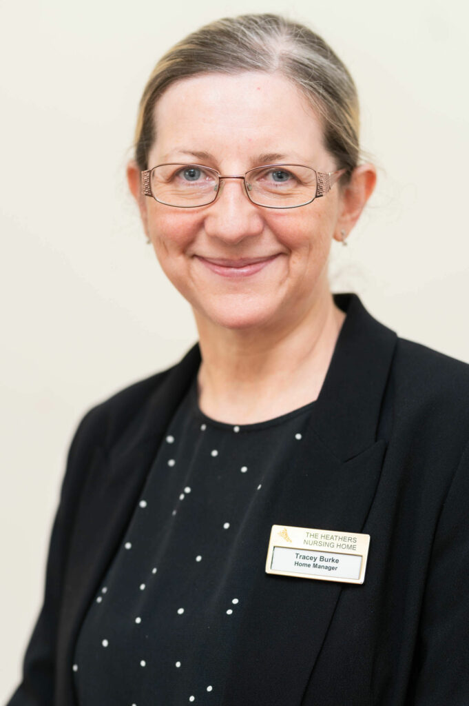 Headshot of a member of staff smiling.