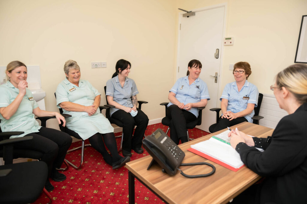 Staff having a meeting.