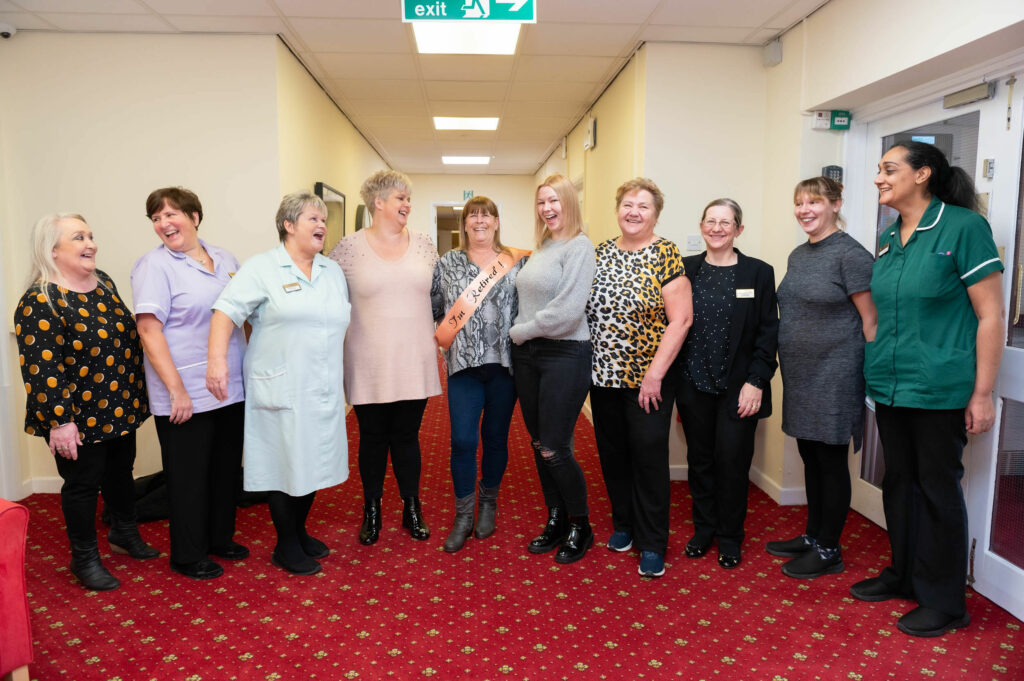 Team photo of 10 members of staff.