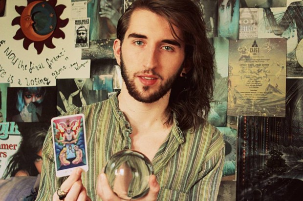 Dan with his tarot card and crystal ball. Photo: Dan Featherstone