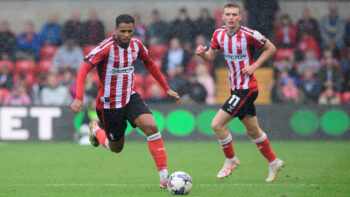 Lincoln City's Ethan Hamilton and Ethan Erhahon