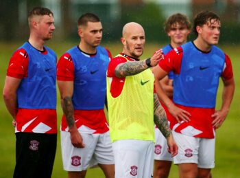 Lincoln United's Paul Grimes leading training