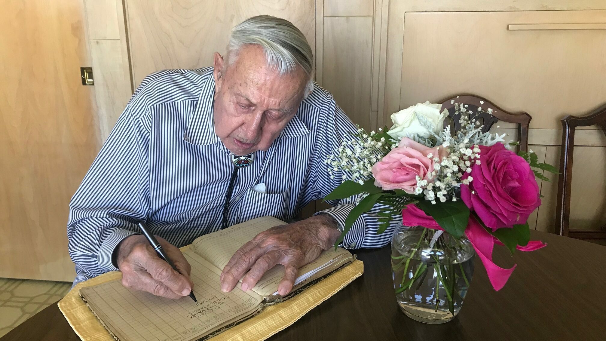 Ervin Wendt signing The Log Book
