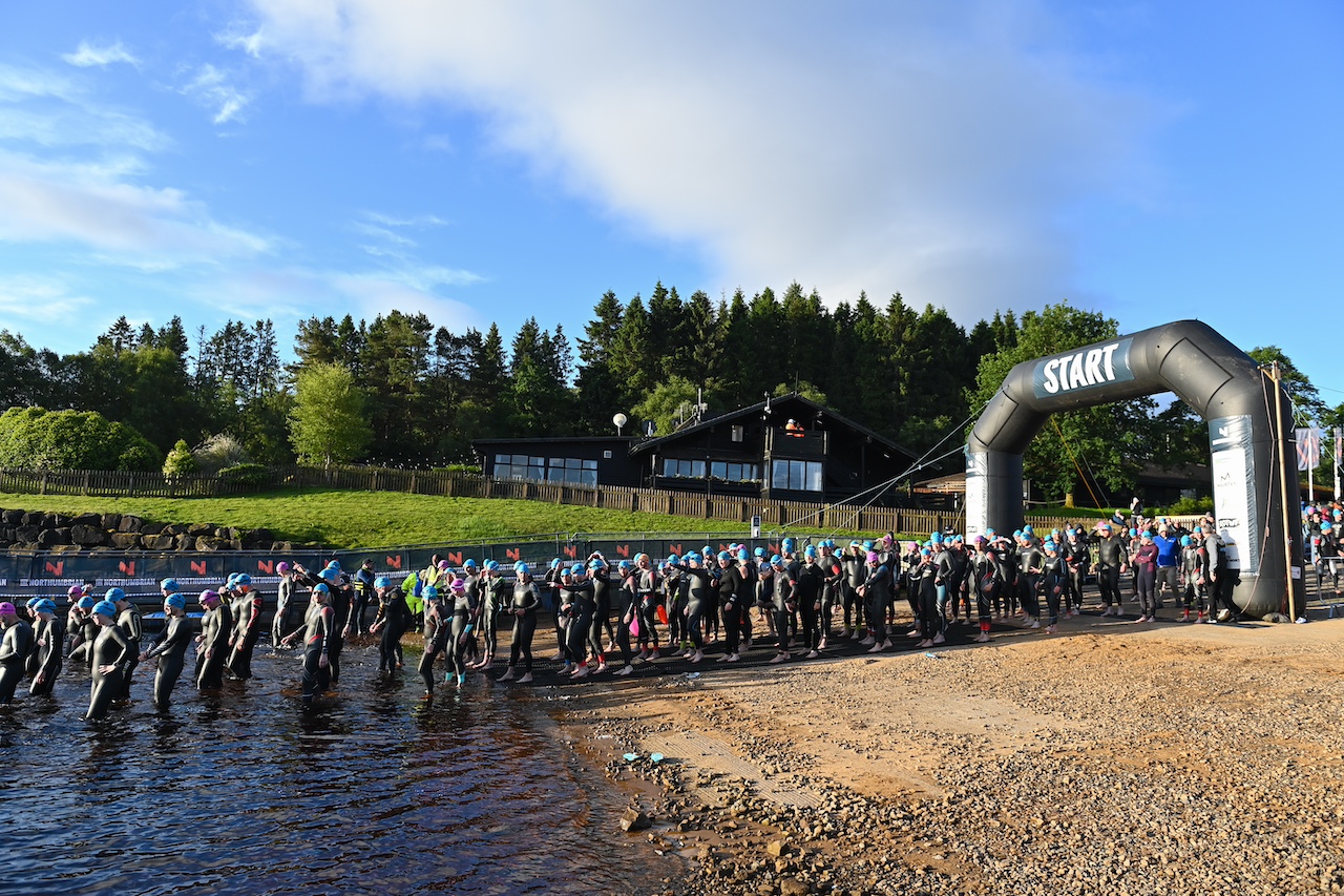 Athletes in wetsuits on the start line of The Northumbrian Triathlon 2024.