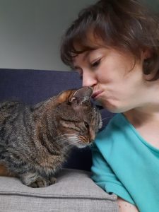Kelly gives her own cat Ziva a kiss on the head