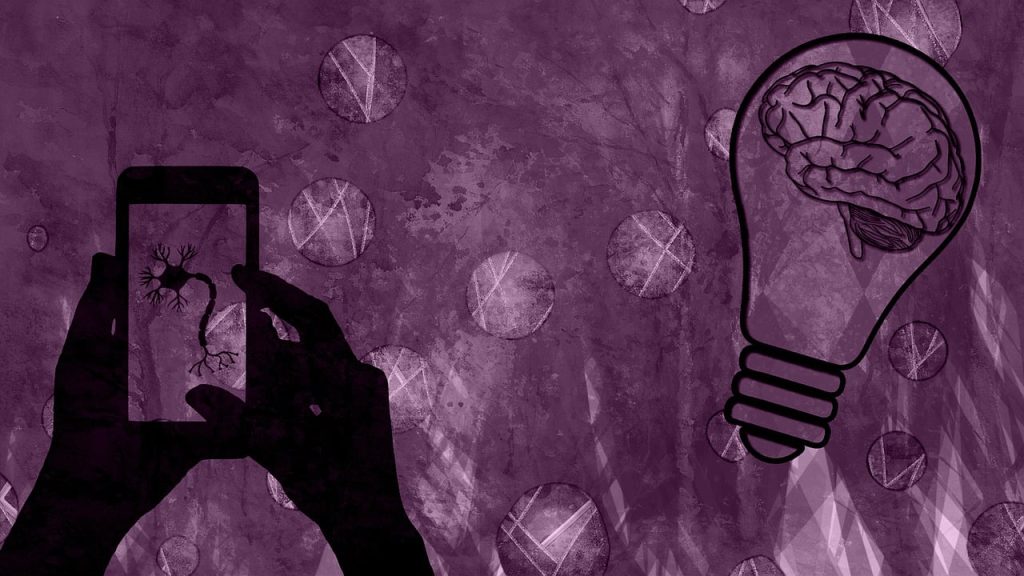 Abstract image on a purple blotchy background with a line-drawn brain inside a light bulb and a pair of black-coloured cartoon hands holding a mobile phone with an image of a neuron on the screen