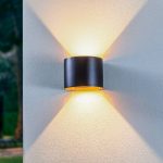 Lindby LED utend⌀rs vegglampe Nivar, rund, svart/gullfarget