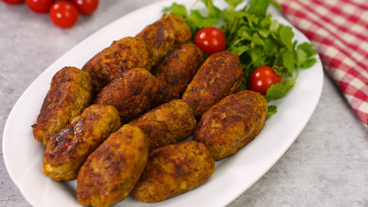 Muthi Kabab Recipe – 7 Powerful Tips to Make Juicy & Delicious Kababs 1 Muthi kababs served on a plate with mint chutney