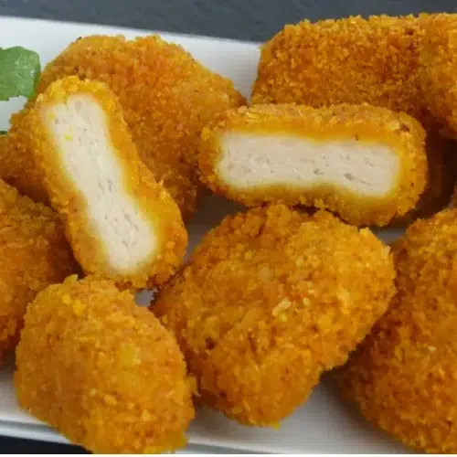 Close-up of chicken nuggets showing the tender inside