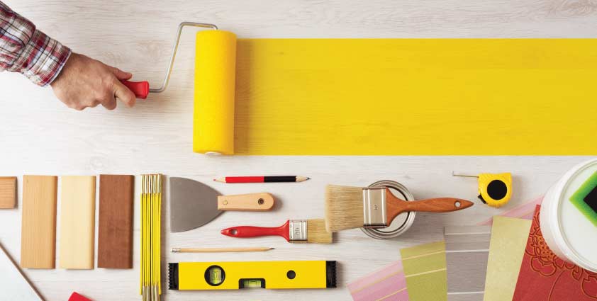 Man painting with tools