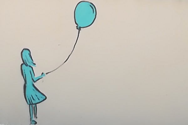 tegning af pige som slipper en ballon