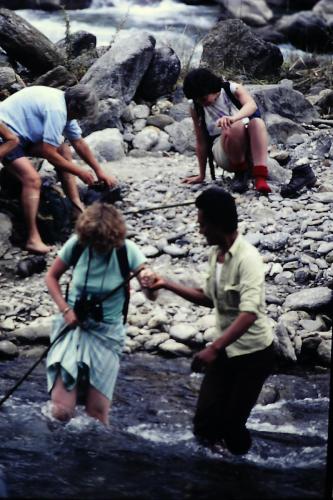 Sherpas helpin to cross a stream
