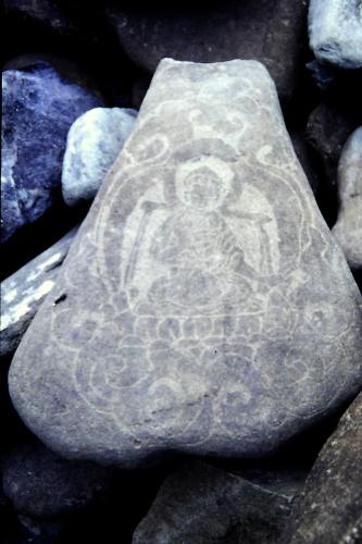 A Mani stone with prayer carved on it