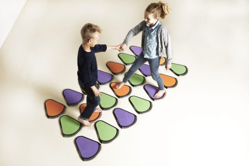 Innovaid TREAX Pads on the floor with boy and girl 1