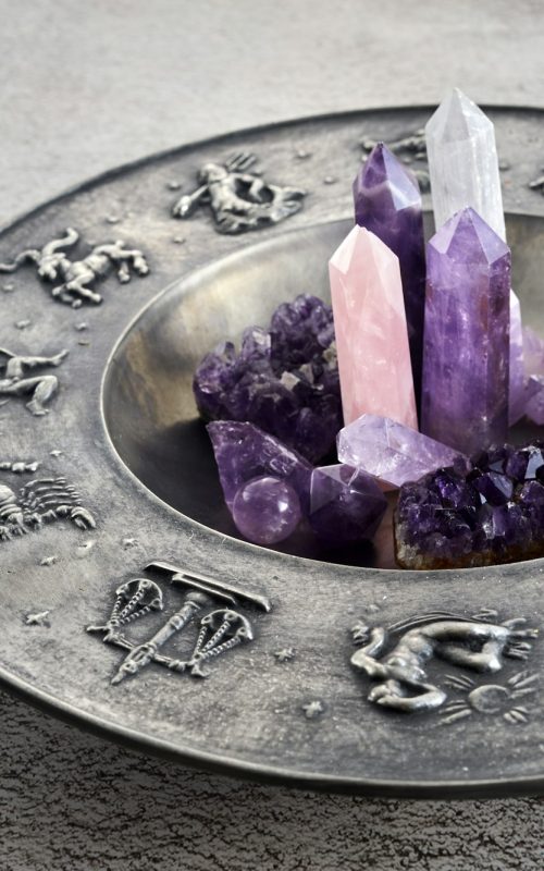 Crystals for healing, fortune telling and astrologhy circle on grey background. Esoteric and life