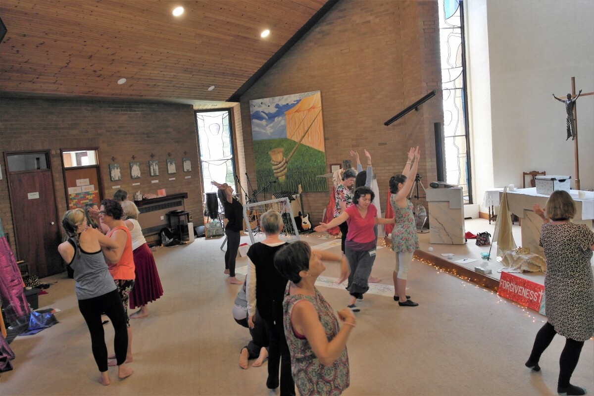 Prayer-dance-as-a-group-1200x800-1 Group of individuals using coloured flags worship dancing