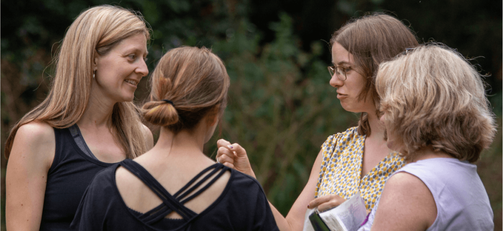 Connecting to the holy spirit. Group of ladies chatting in a circle.