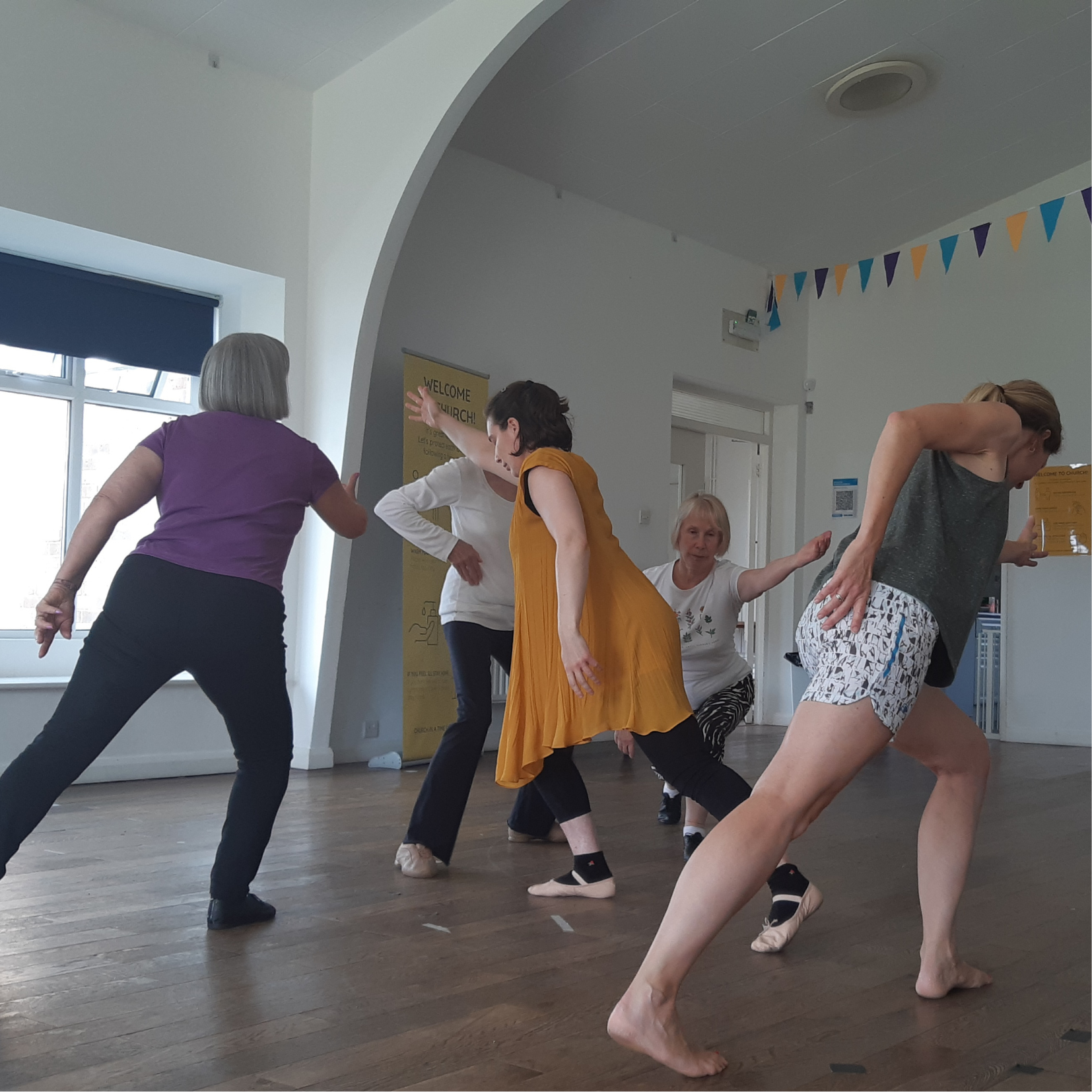 Dancers exploring reaching for God in movement