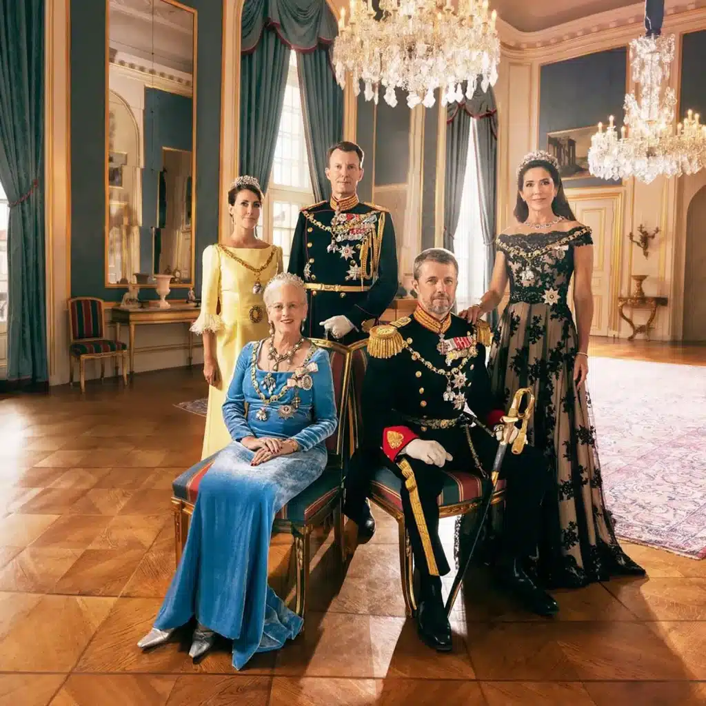 Queen Margrethe II of Denmark with her sons, Crown Prince Frederik (seated) and Prince Joachim, and their respective wives, Crown Princess Mary (right) and Princess Marie.