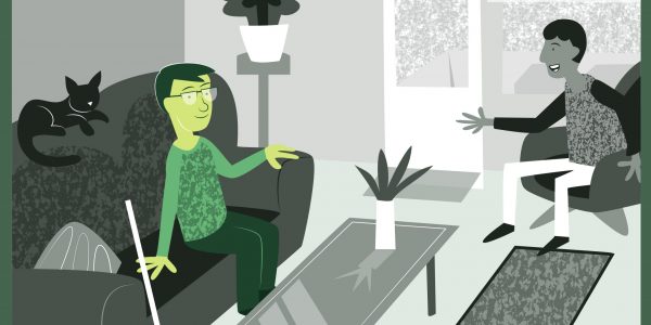 Bilden visar en person som sitter hemma i sin lägenhet och samtalar med en gäst. De verkar trivas i miljön