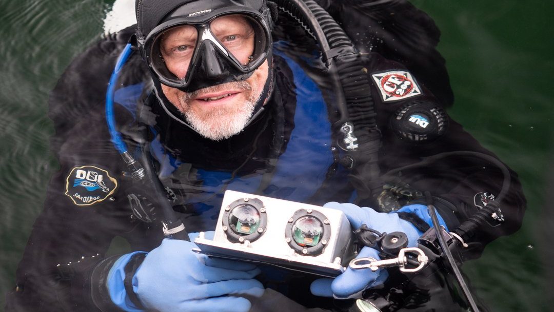 Diver holding the UVision 3D underwater scanner. The scanner can be handheld as in the photo, mounted to an ROV, or used on the end of a pole.