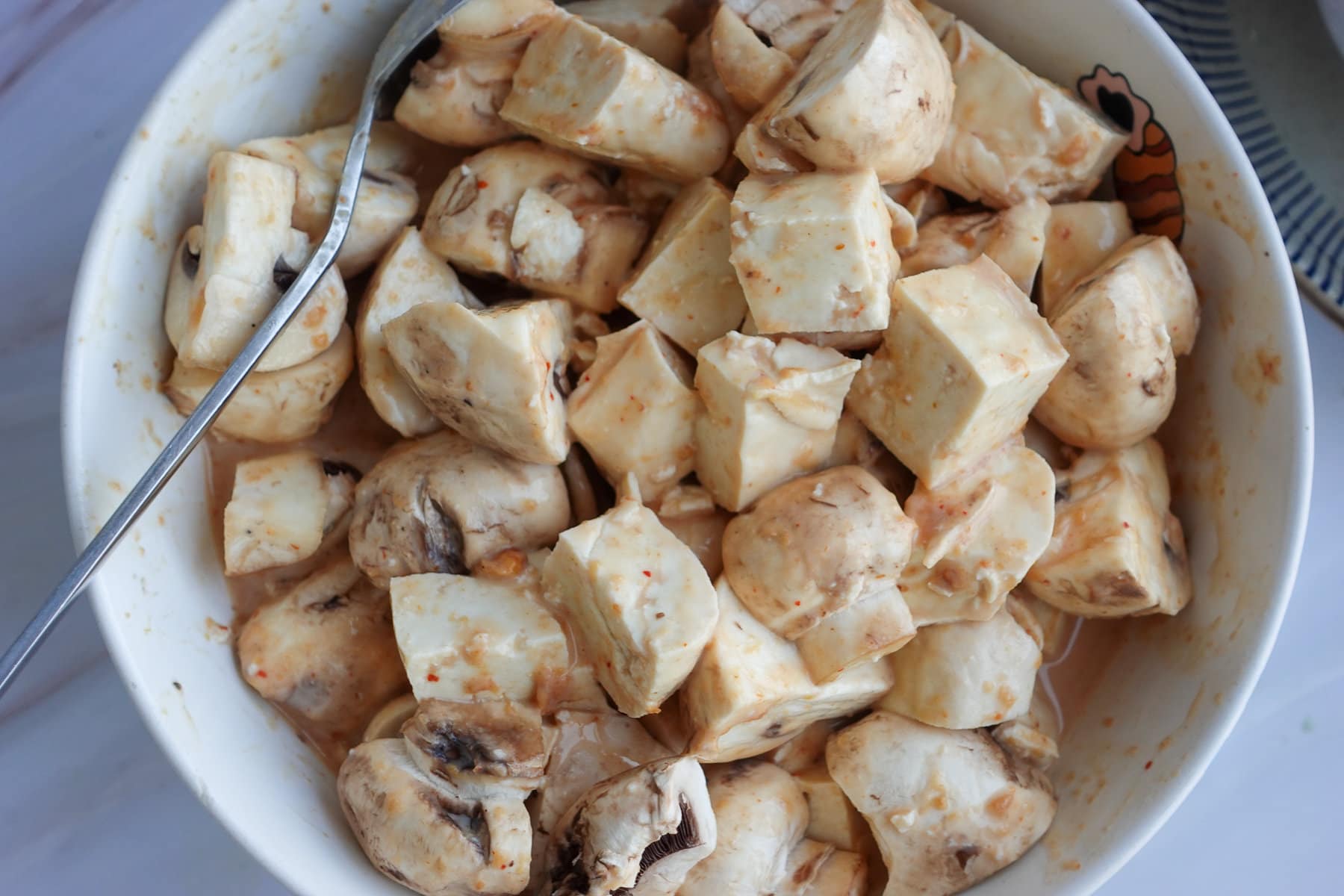 Marinate the tofu and mushrooms