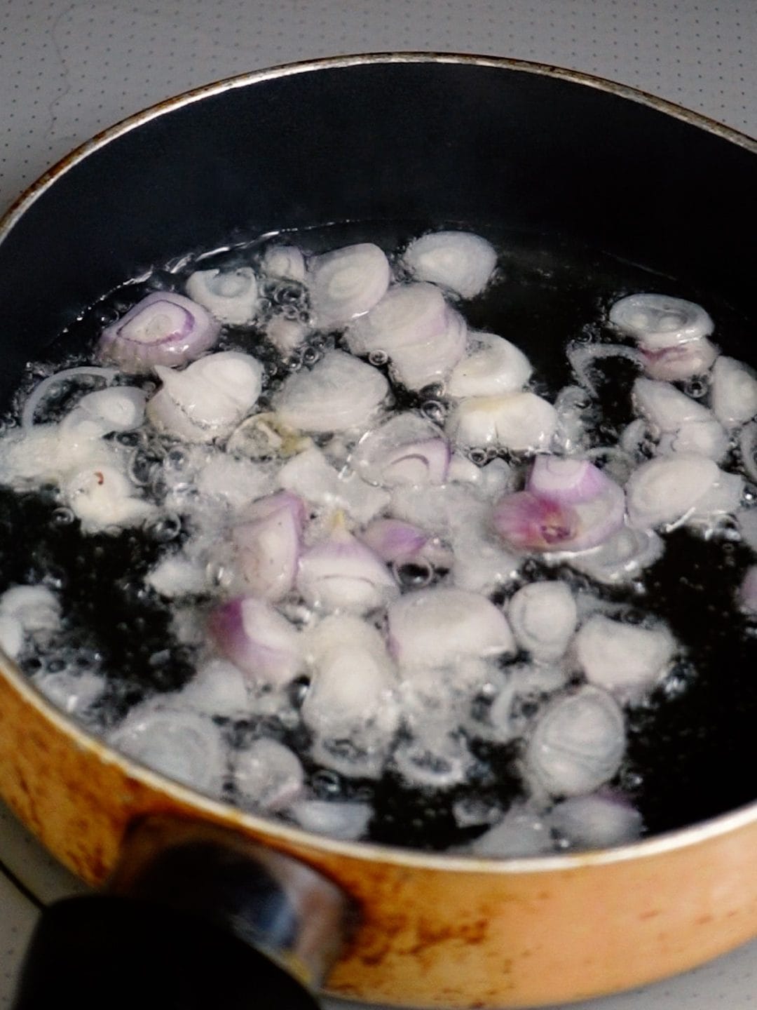 Shallots in a frying pan