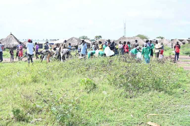 cleaning operations to remove plastic debris and polythene bags from a fishing community on Lake Albert