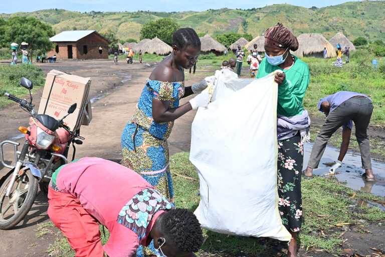 cleaning operations to remove plastic debris and polythene bags from a fishing community on Lake Albert