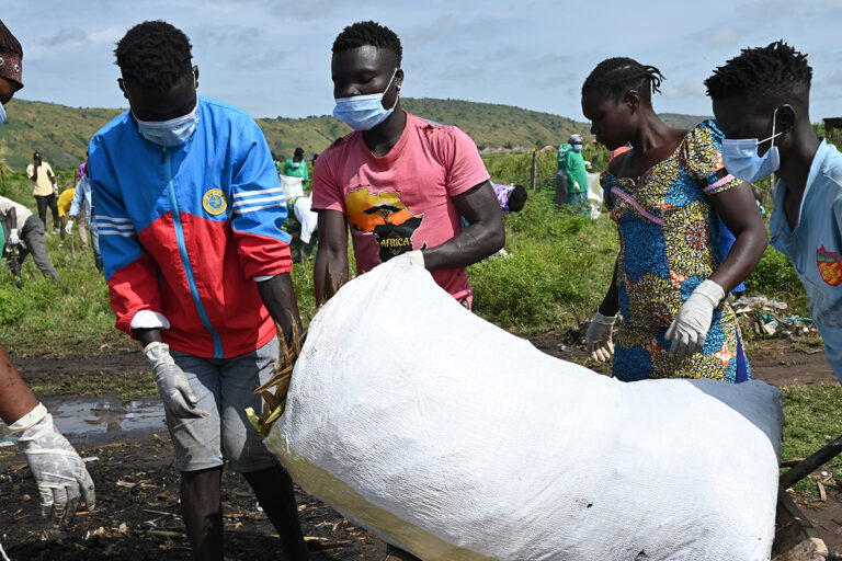 cleaning operations to remove plastic debris and polythene bags from a fishing community on Lake Albert