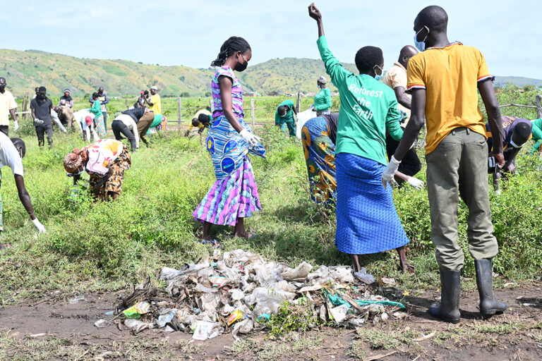 cleaning operations to remove plastic debris and polythene bags from a fishing community on Lake Albert