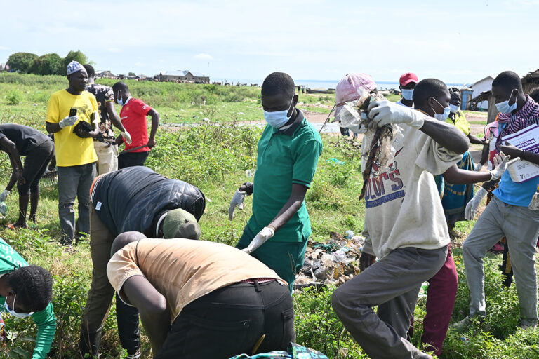 cleaning operations to remove plastic debris and polythene bags from a fishing community on Lake Albert