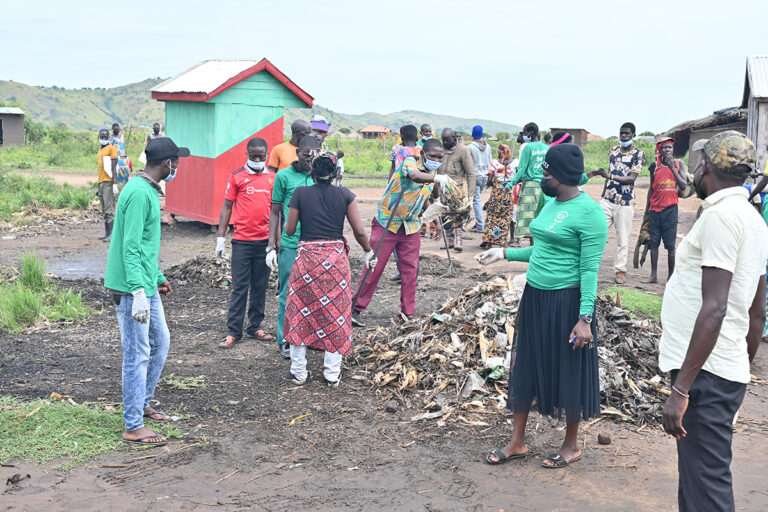 cleaning operations to remove plastic debris and polythene bags from a fishing community on Lake Albert