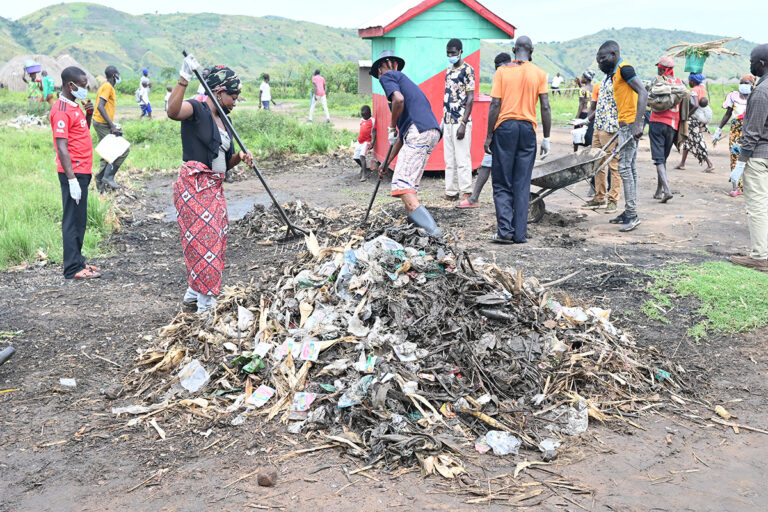 cleaning operations to remove plastic debris and polythene bags from a fishing community on Lake Albert