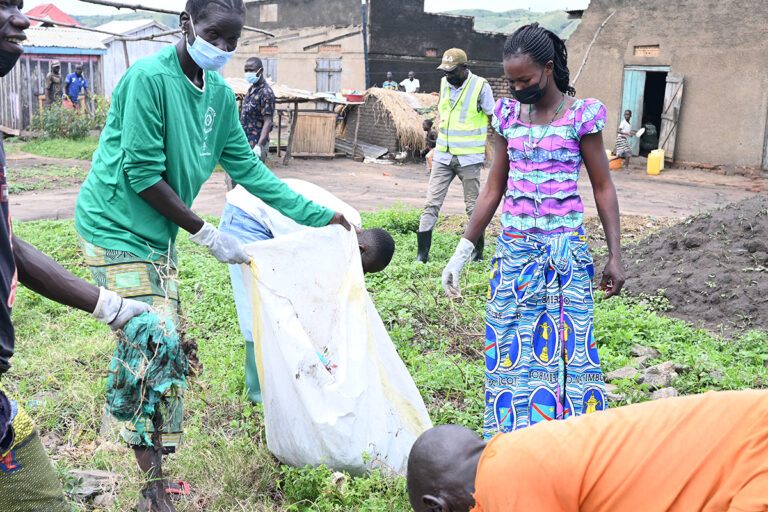 cleaning operations to remove plastic debris and polythene bags from a fishing community on Lake Albert