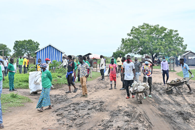 cleaning operations to remove plastic debris and polythene bags from a fishing community on Lake Albert