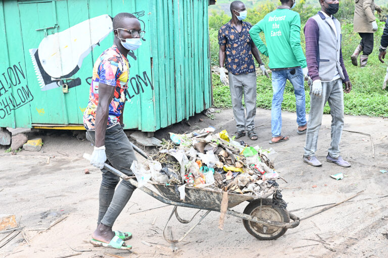 cleaning operations to remove plastic debris and polythene bags from a fishing community on Lake Albert