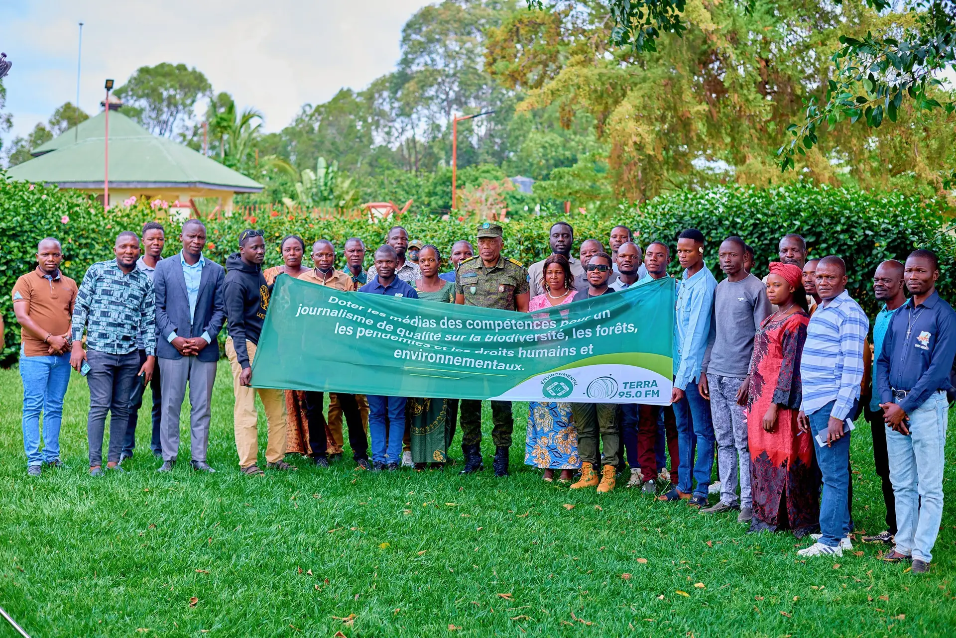 Journalists posed for photos with the Mahagi territory military administrator during the training organized by the Environmental Defenders in Mahagi-Ituri province, DRC.