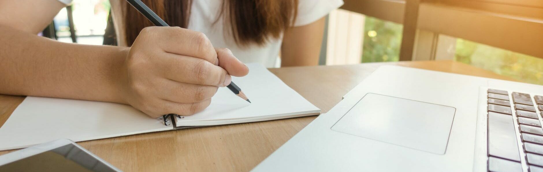 woman about to write on paper