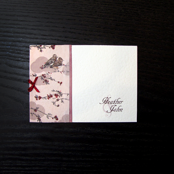 Wedding invitations with a lark theme, incorporating the couple-to-be's surname. Red and coral colour scheme.