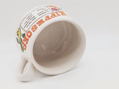 Vintage soepkom met oranje letters en recept kippesoep.