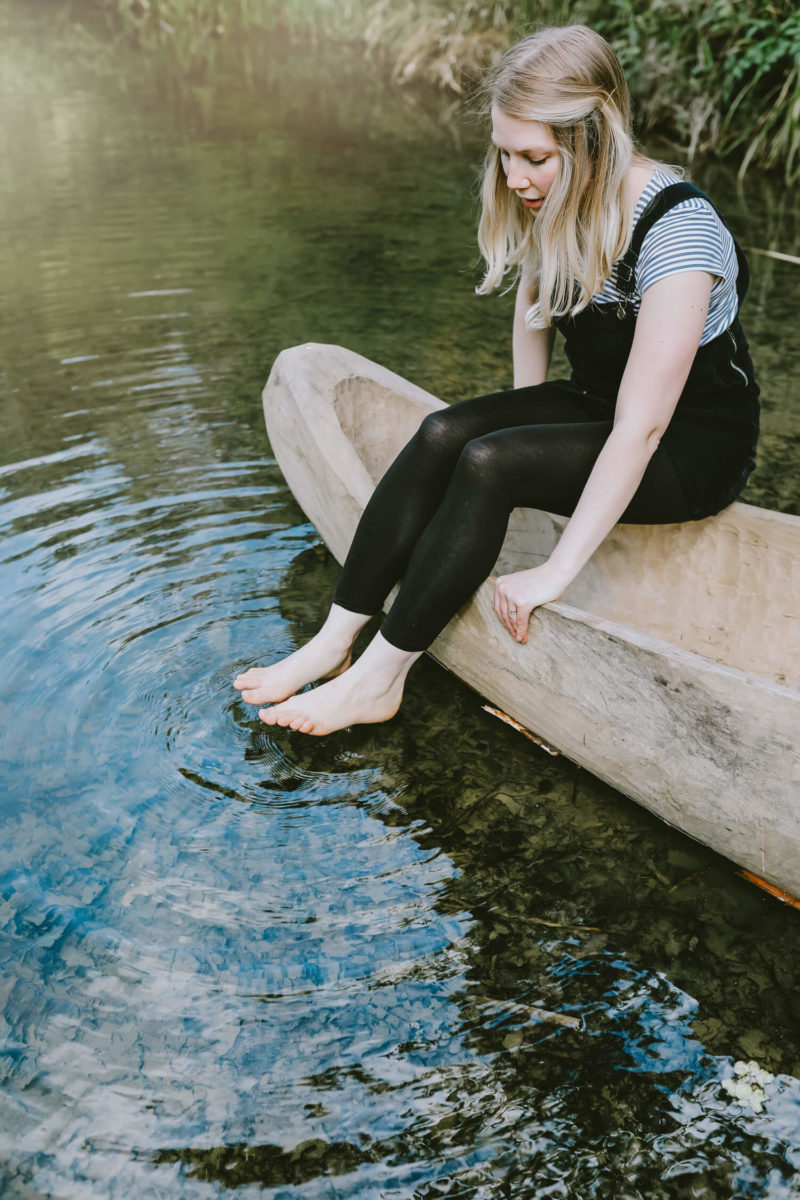 Girl dipping her toes in the water