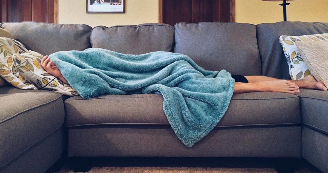 person lying on sofa