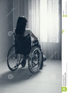 sad-woman-sitting-wheelchair-young-seated-looking-out-window-30985273