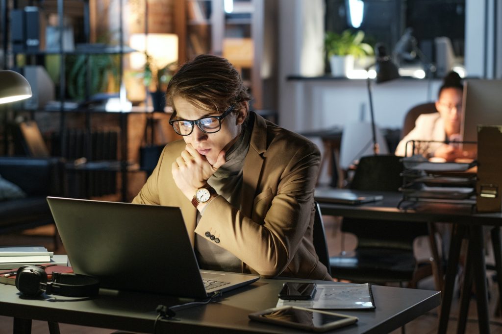 Focused man working with laptop