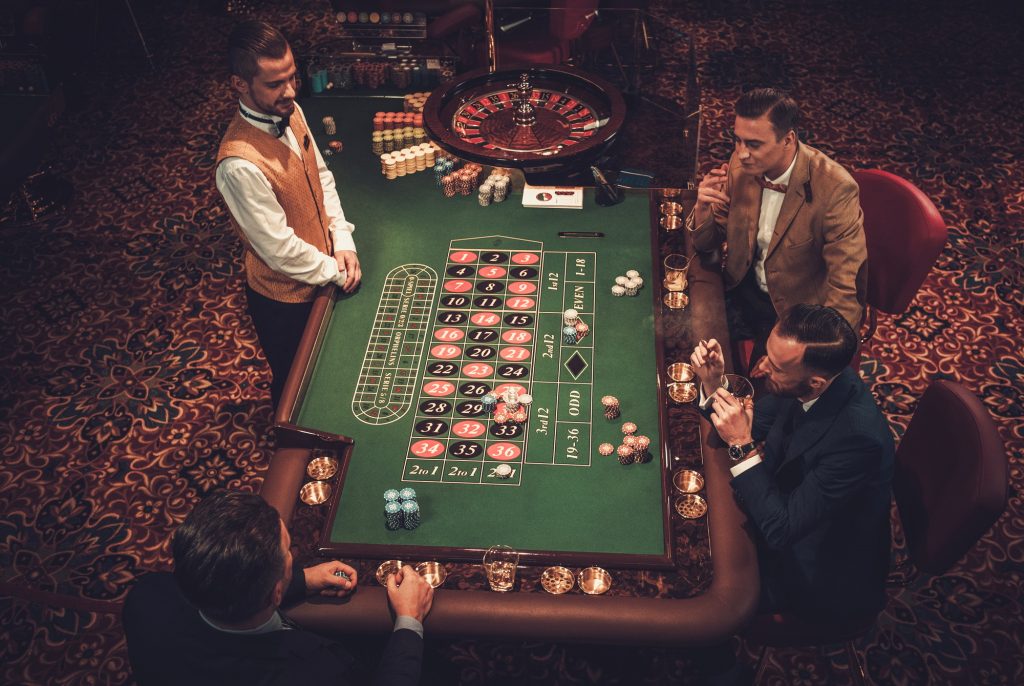 Upper class friends gambling in a casino