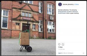 Instagram post from @hannah_directory showing 2 cardboard boxes outside the front of a building