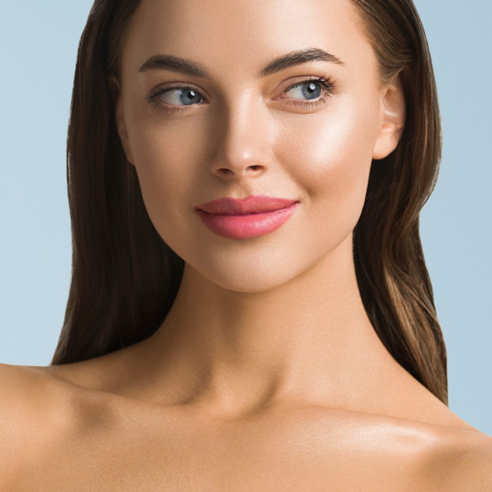 Beauty woman skin care beautiful female cosmetic girl model over Beauty woman skin care beautiful female cosmetic girl model over blue background