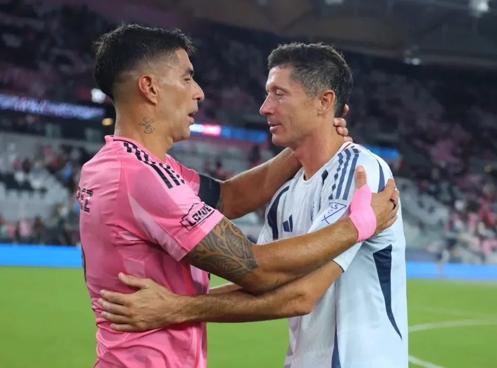 Luis Suárez #9 of Inter Miami CF greets Robert Lewandowski #9 of Chicago Fire after the MLS match between Inter Miami CF and Chicago Fire FC at Nu Stadium on July 22, 2026 in Miami, Florida. (Photo by Megan Briggs/Getty Images via AFP)
