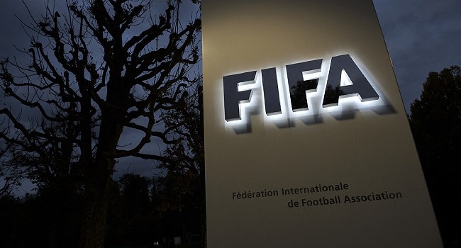 This photo taken on October 8, 2015 in Zurich shows the entrance sign with the logo at the FIFA world headquarters. FABRICE COFFRINI / AFP